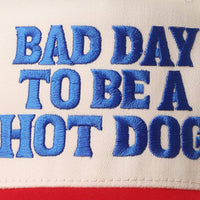 BAD DAY TO BE A HOT DOG Embroidered Trucker Hat : RYL/NATL / One Size